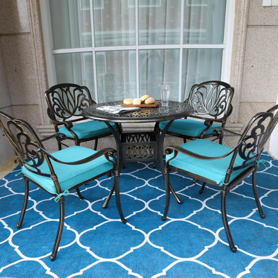 4 - Person Patio Dining Set Umbrella Hole Included Round Table with Cushions Included