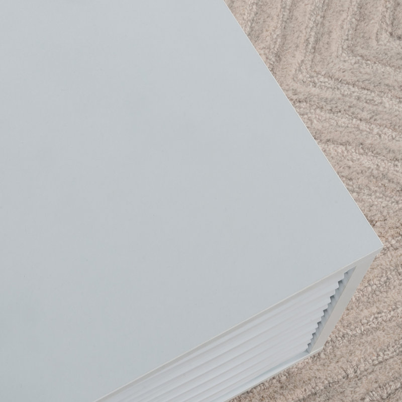 Élégante table basse blanche avec plateau spacieux et deux tiroirs, parfaite pour la vie moderne et les solutions de rangement.