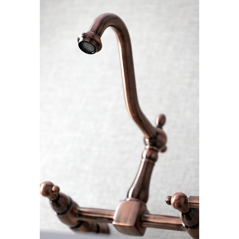 Kingston Brass Heritage Double-Handle 2-Hole Wall-Mount Bridge Kitchen Faucet, Antique Copper/White