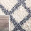 Tapis ivoire à motif géométrique-396230420