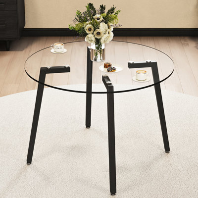 Table en verre trempé transparent 107 x 107 x 75 cm, pattes en métal, idéale pour la cuisine et la salle à manger. Table moderne noire 107 x 107 x 75 cm, convient aux espaces de vie.