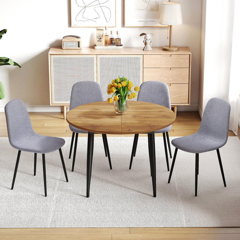 Ensemble de table et de chaises. Table de salle à manger moderne en MDF extensible. Convient pour des rassemblements de tailles différentes.