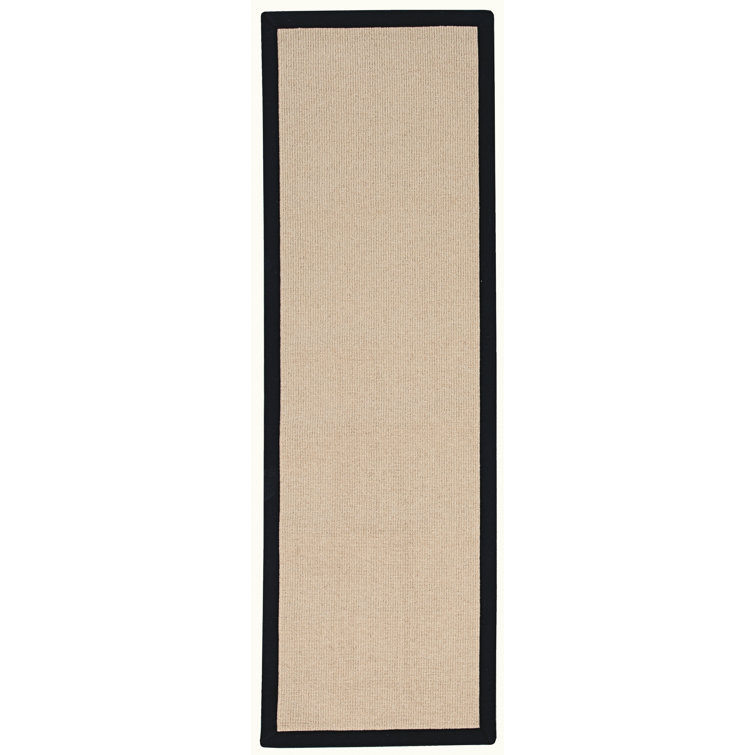 Nannette Handmade Light Beige Berber with Black Faux Leather Border Area Rug