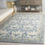 Tapis en laine, coton et viscose touffeté à la main ivoire et bleu Louella-1144609786