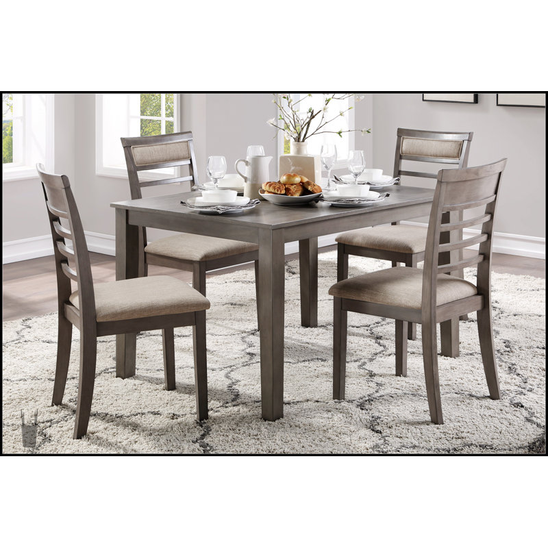 Élégant ensemble de salle à manger à finition grise 5 pièces avec chaises rembourrées en tissu et table spacieuse pour les cuisines modernes