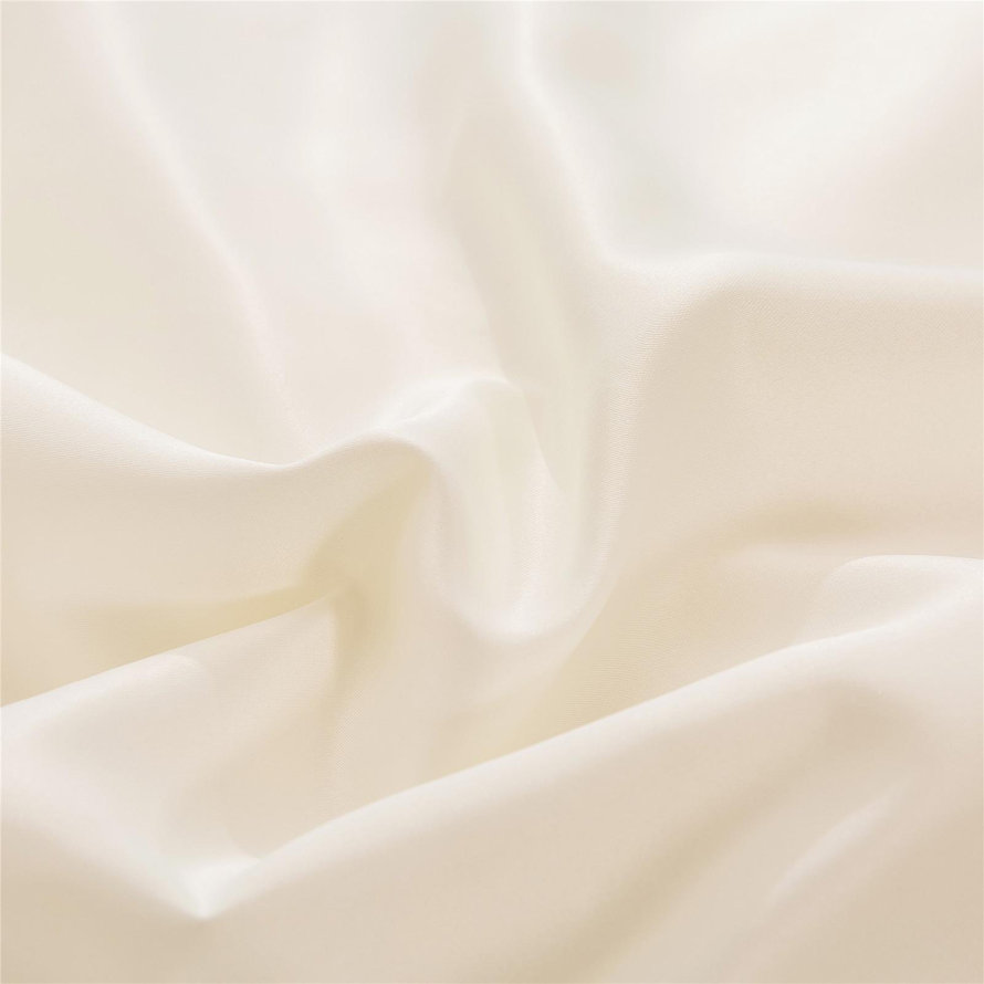 Close-up of ivory colored silk fabric.