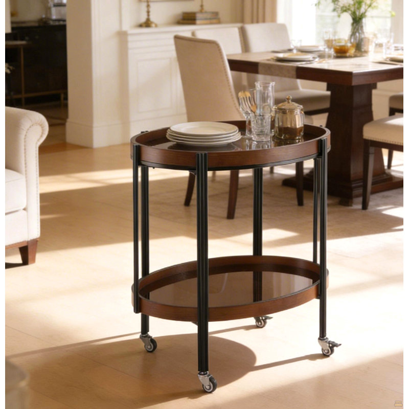 Chariot-bar ovale en noyer foncé à 2 tablettes avec structure en métal noir et verre trempé brun