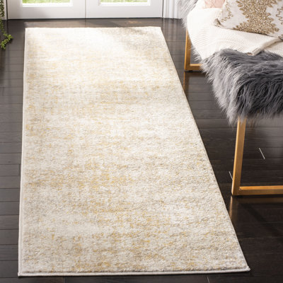 Tapis crème / doré Bethlyn