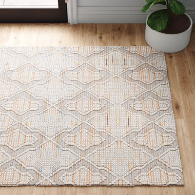 Tapis géométrique ivoire / orange tissé à la main à motif géométrique