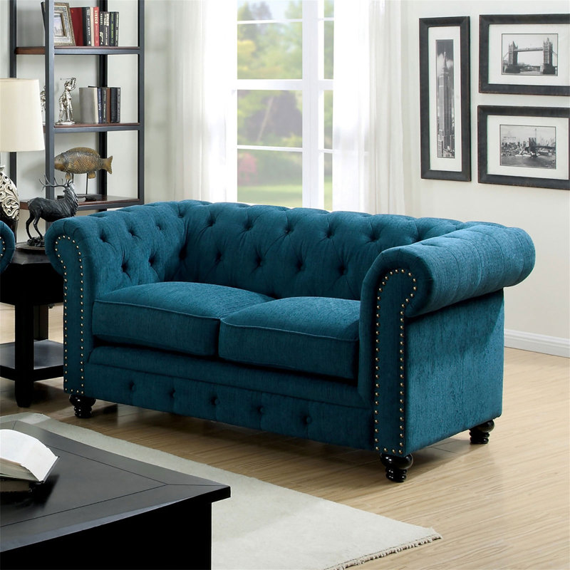 Causeuse contemporaine capitonnée de couleur bleu sarcelle à boutons capitonnés et capitonnée