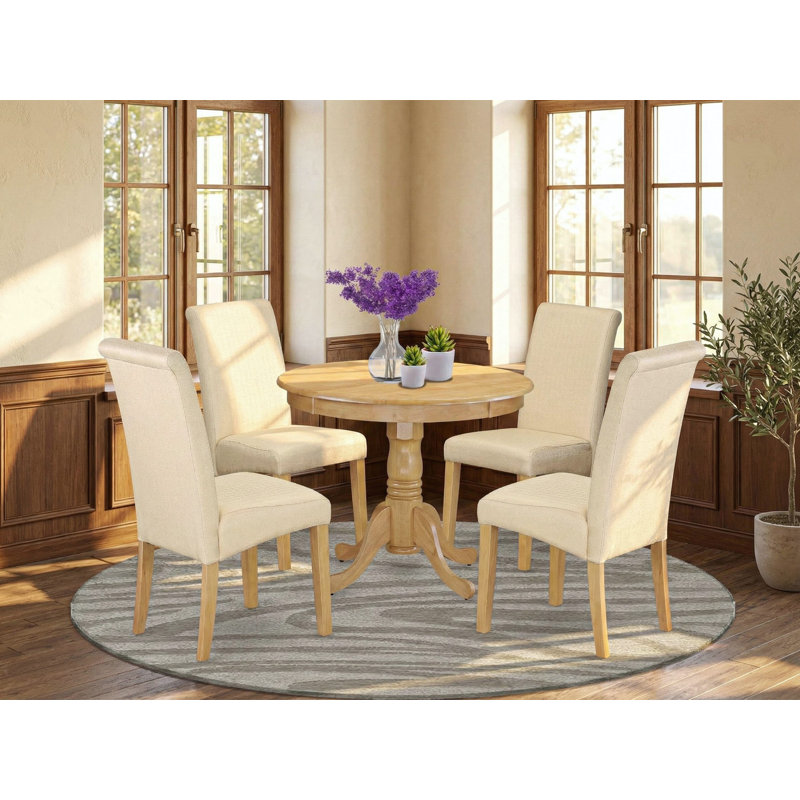 L'ensemble de salle à manger 5 pièces pour 4 personnes comprend une table de cuisine ronde avec piédestal et 4 chaises de salle à manger Parson en lin beige clair, chêne