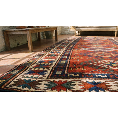 Tapis kazak antique à motif géométrique coloré