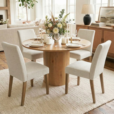 Danayla 4 - Person Dining Table Sets With 41.5'' Round Table & 4 Upholstered Linen Chairs