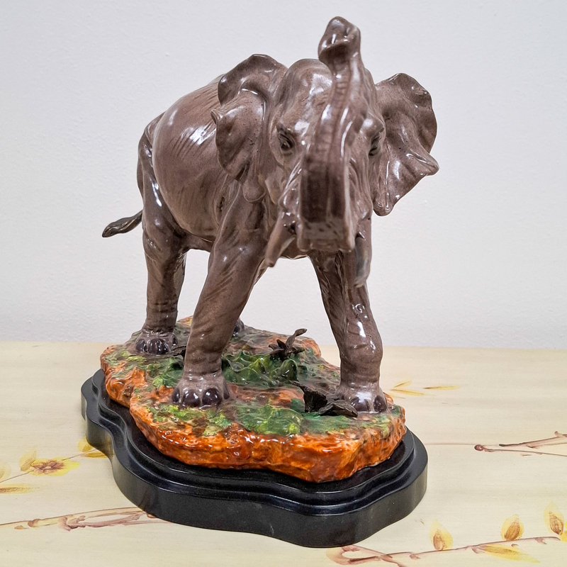 Porcelain Elephant Figurine With Bronze Tusks and Tail Accents On Wood Base
