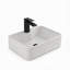 Vasque de salle de bain rectangulaire en céramique blanche de 40,6 cm x 30,5 cm avec robinet et bonde noirs.