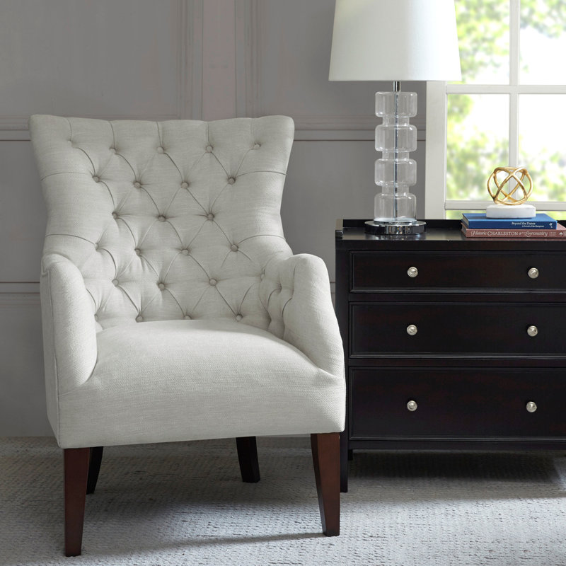 Fauteuil à oreilles capitonné