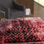 Tapis abstrait rouge / noir Mangassa-1728405538