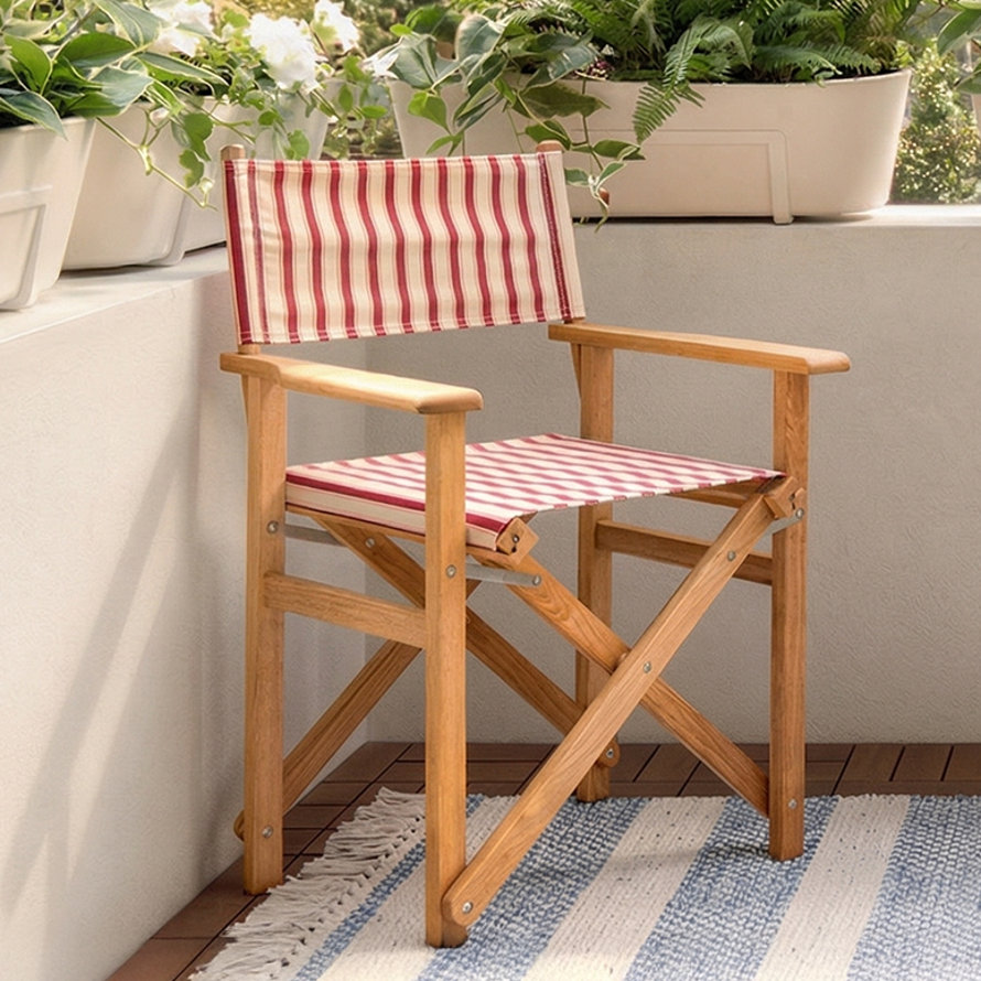 Red and white striped folding director chair on patio