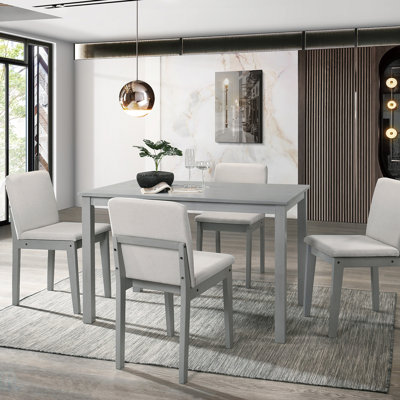 Ensemble de salle à manger transitionnel 5 pièces avec chaises rembourrées et placage en bois d'hévéa, parfait pour les maisons modernes et traditionnelles.