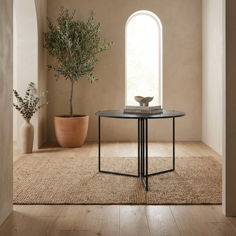Table de salle à manger ronde moderne avec piètement géométrique en métal