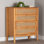 Commode 4 tiroirs en bois brun doré et brun avec rotin patiné Betzayda Baxton Studio Jenn