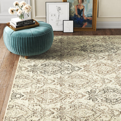 Tapis beige rond à motif floral Levi
