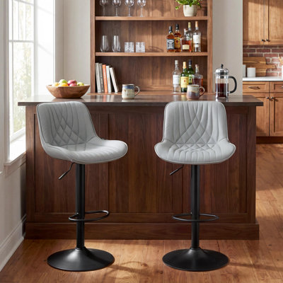 Tabouret de bar pivotant en similicuir Zager