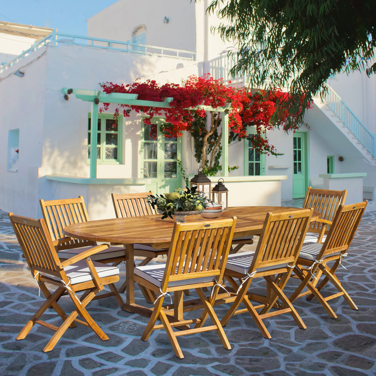 Coster 8 - Person Teak Wood Patio Dining Set with Round Table