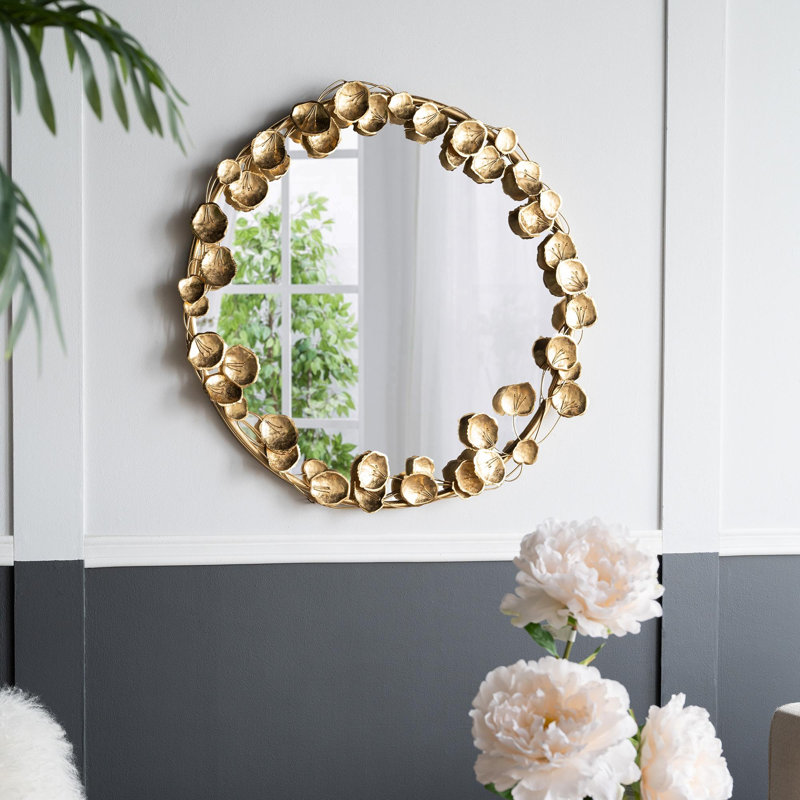 Miroir mural rond en métal avec détails dorés