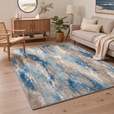 Tapis abstrait ivoire / bleu lavable à la machine avec envers antidérapant