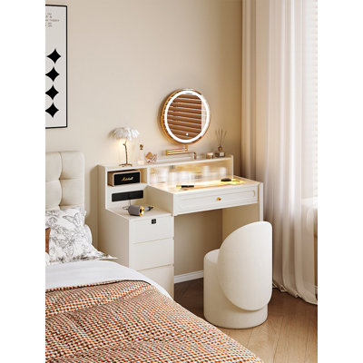 Coiffeuse et commode monobloc de style minimaliste français, couleur crème, avec tabouret.