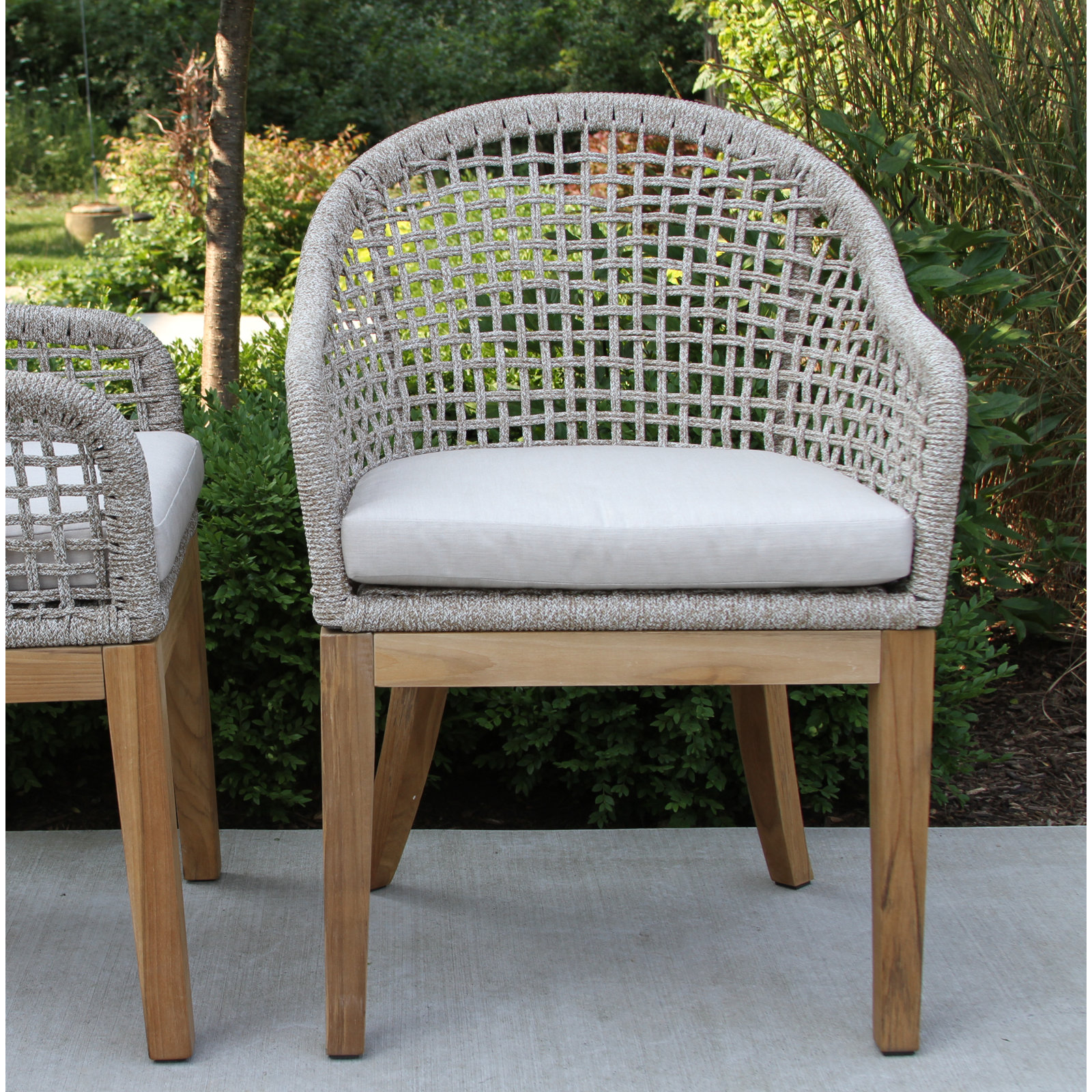 Akiva 52'' Round 4 - Person Outdoor Dining Set with Sunbrella Cushions