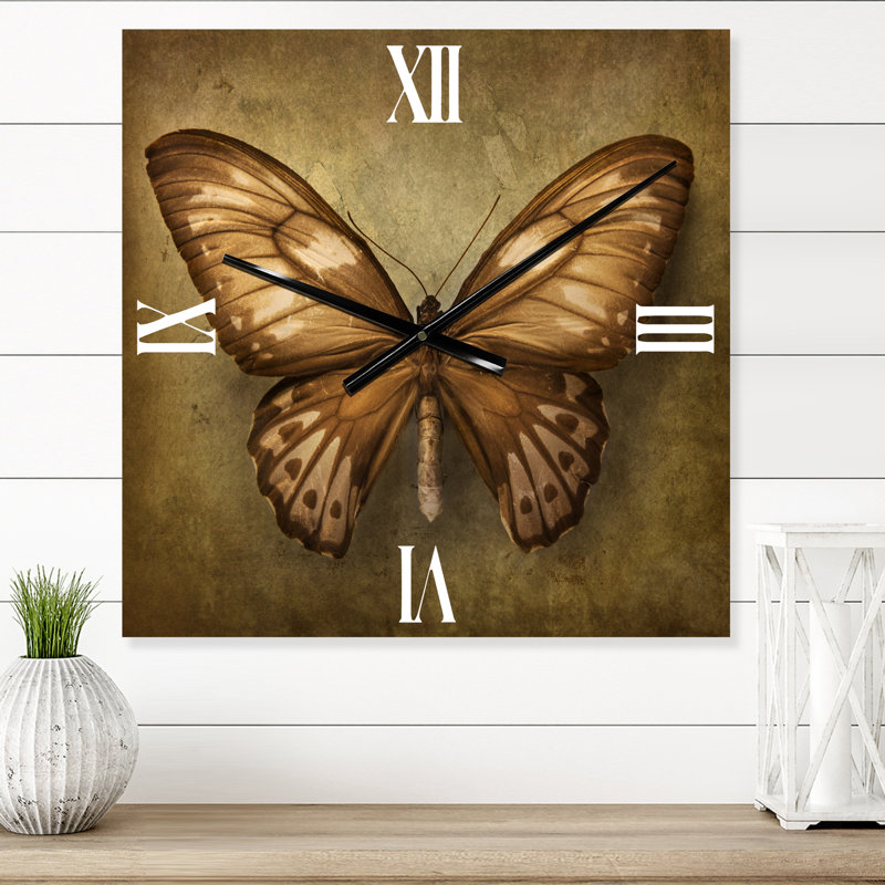 Horloge murale papillon, Moyen