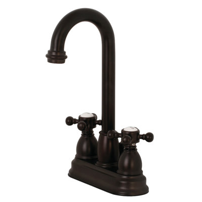 Kingston Brass Two-Handle 3-Hole Deck Mount 4" Centerset Bathroom Faucet with Plastic Pop-Up