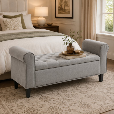 Grey 50-inch button-tufted upholstered storage bench featuring rolled arms and solid wood legs; offers large-capacity storage with a flip-top lid—vers