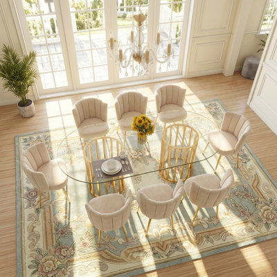 Ensemble de table de salle à manger moderne et luxueux en verre ovale pour 8 personnes, meubles de salle à manger de cuisine à la maison avec structure en métal robuste, chaises ergonomiques rembourrées en velours, plateau de table transparent, chaises blanches