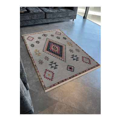 Tapis décoratif beige multicolore à motif frangé et lavable à la machine