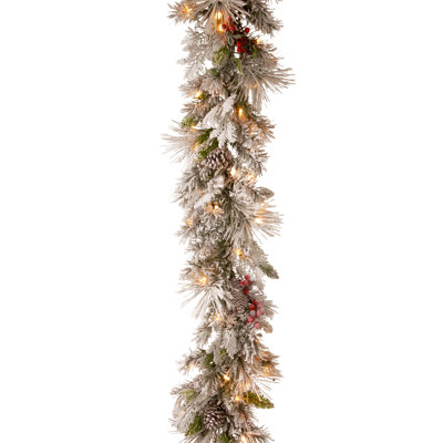 The Holiday Aisle® 9ft. Snowy Bedford Pine Garland with LED Lights