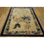 Petit tapis rectangulaire en laine noué à la main de couleur ivoire antique