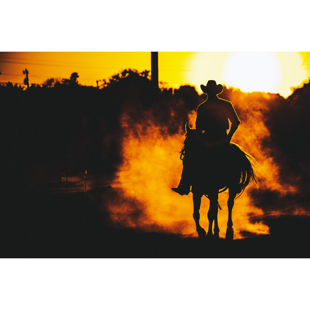 Cowboy Riding In Sunset von Peeterv - Leinwandbild