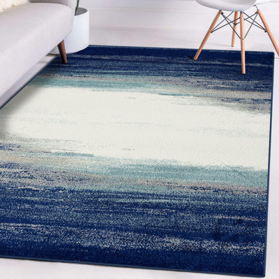 Tapis bleu / crème à motif abstrait Rifiki