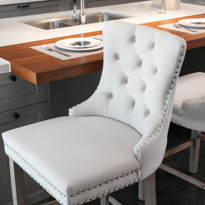 Tabourets contemporains rembourrés en velours avec boutons capitonnés