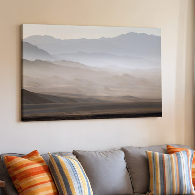 Canvas A Serene Desert Landscape At Dawn Featuring A Series Of Wall Art Softly Undulating Mountains In The Background Shrouded In A Canvas Wall Art