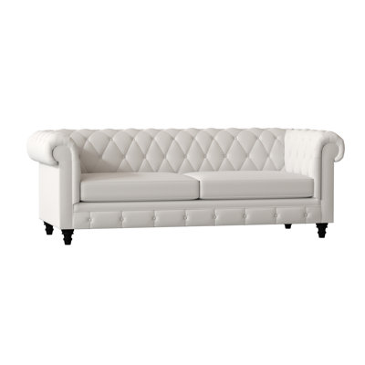 Canapé Chesterfield à accoudoirs roulés