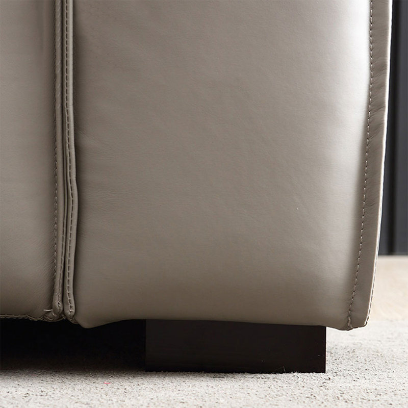 Canapé modulaire gris en cuir véritable avec repose-pieds