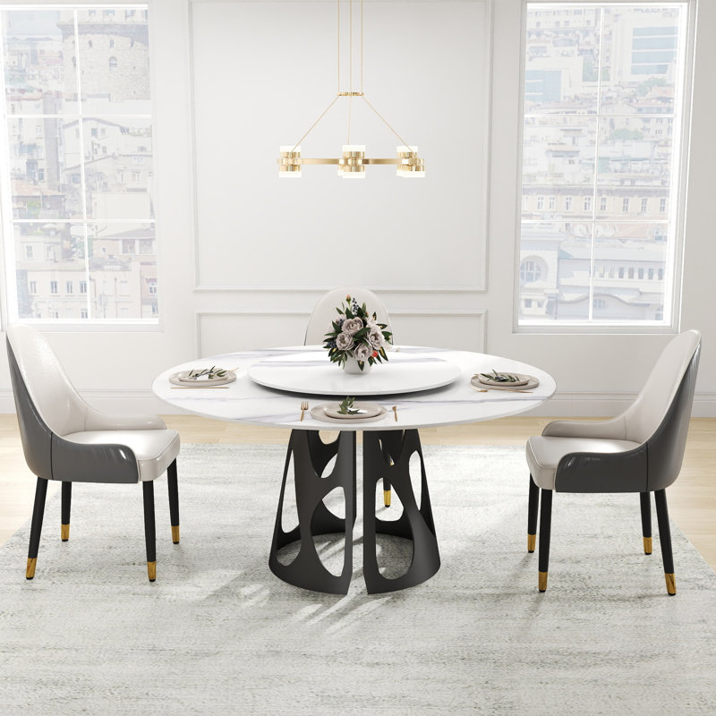 Ensemble de tables de salle à manger élégantes rondes en pierre frittée de conception moderne pour des espaces polyvalents