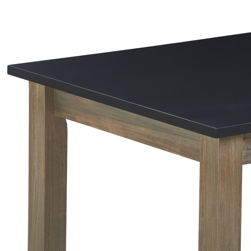 Table de salle à manger Tommy Hilfiger Elmhurst de 162,5 cm de large, style ferme moderne, dessus noir et piètement en chêne gris, lignes épurées et design à tréteaux.