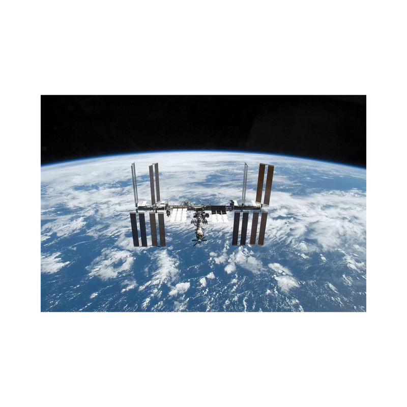 The International Space Station In Orbit Above Earth by Stocktrek Images - Wrapped Canvas Print, 20.32 cm H x 30.48 cm W