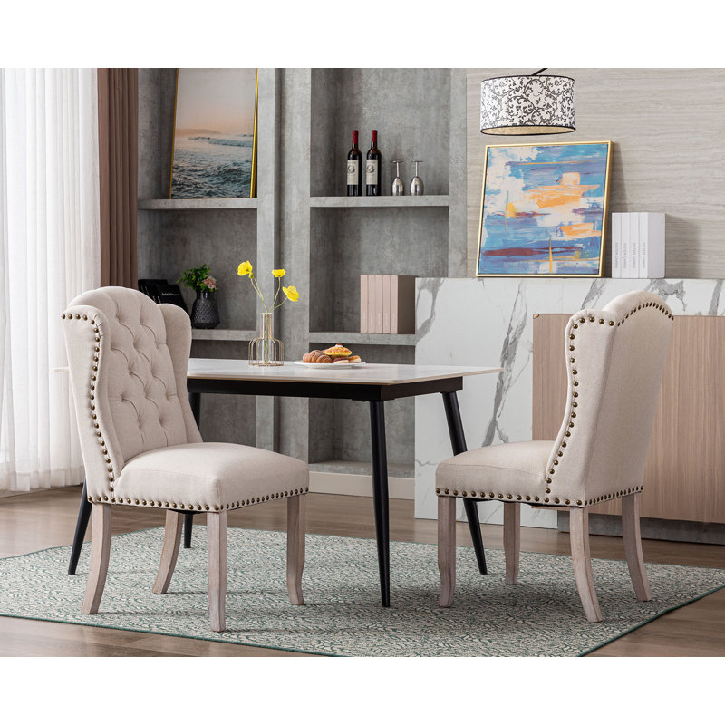 Chaise de salle à manger à garniture cloutée et capitonnée Jolynn, Beige, Bois