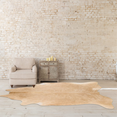 Tapis en peau de vache beige personnalisé